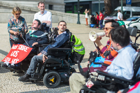 PORTO, PORTUGAL - MAY 5, 2019: Manifesto for Independent Life (the march of disabled people) Demanding compliance with rights in terms of personal assistance, housing, employment, education, transportのeditorial素材