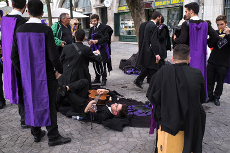 PORTO, PORTUGAL - MAY 6, 2019: During Queima das Fitas is a traditional festivity of Portuguese students of universities. Freshmen wear funny/silly outfits same colour as their Faculty and sing songs.のeditorial素材