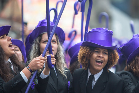 PORTO, PORTUGAL - MAY 7, 2019: During Cortejo Queima das Fitas - annual festivity of Portuguese students of universities. The graduates wear a top-hat and a walking-cane, both colour of their Faculty.のeditorial素材