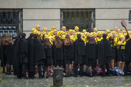 PORTO, PORTUGAL - MAY 7, 2019: During Cortejo Queima das Fitas - annual festivity of Portuguese students of universities. The graduates wear a top-hat and a walking-cane, both colour of their Faculty.のeditorial素材