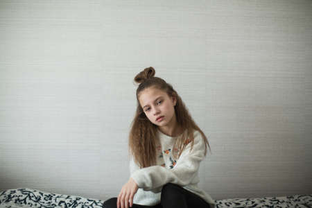 Cute teen girl posing in her room for portrait.の写真素材