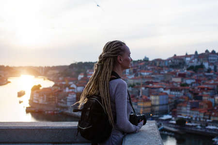 Tourist woman on view point opposite Ribeira on Douro river, Porto, Portugal.の写真素材