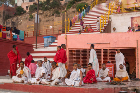 VARANASI, INDIA - MAR 20, 2018: Banks on the holy Ganges river in the early morning. According to...