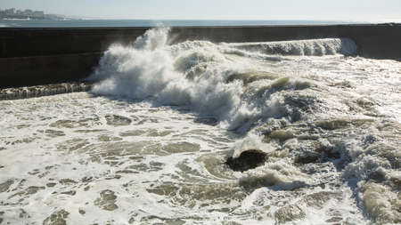 Ocean surf on the city's waterfront. Porto, Portugal.