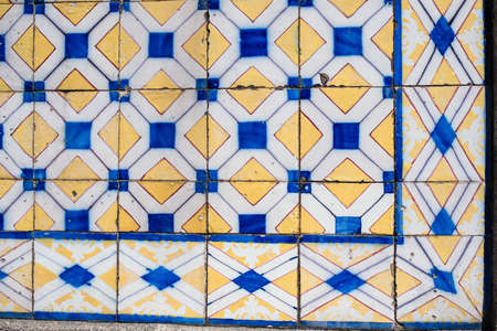 Traditional old tiles wall on the street Portuguese painted tin-glazed, azulejos ceramic tilework. の写真素材