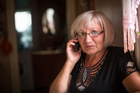 Portrait of an adult woman talking on the phone.