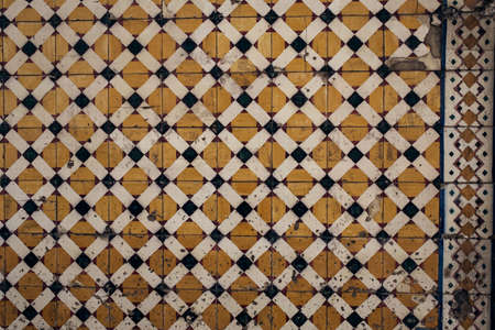 Traditional old tiles wall on the street Portuguese painted tin-glazed, azulejos ceramic tilework. Porto, Portugal.の写真素材