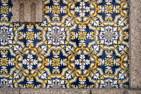 Traditional old tiles wall on the street Portuguese painted tin-glazed, azulejos ceramic tilework....