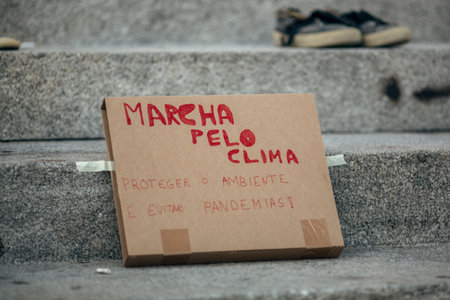 PORTO, PORTUGAL - SEP 25, 2020: During the Global Strike for Climate. Participants arranged an installation of old shoes on the steps in front of Porto City Hall.のeditorial素材