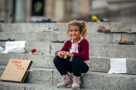 PORTO, PORTUGAL - SEP 25, 2020: During the Global Strike for Climate. Participants arranged an installation of old shoes on the steps in front of Porto City Hall.のeditorial素材