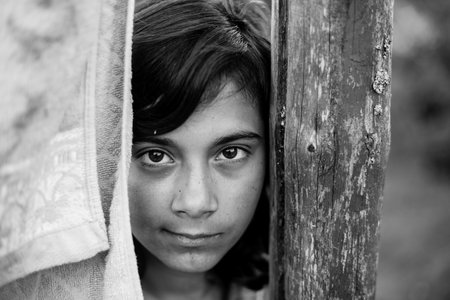 Portrait of dark-haired teen girl outdoors. Black and white photo.の写真素材