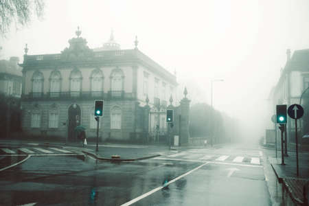 View of the deserted foggy street, Porto, Portugal.