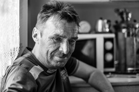 A man farmer in his rural home. Black and white photo.の写真素材