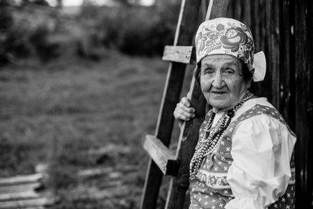 Portrait of old country woman. Black and white photo.の写真素材