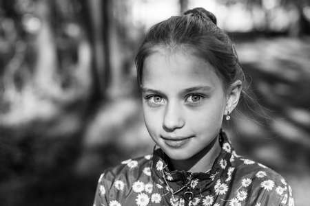 Portrait of teen girl outdoor. Black and white photo.