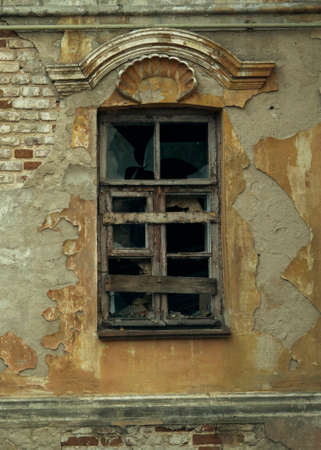 Abandoned. A window in an old ruined house.