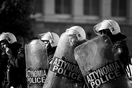 ATHENS, GREECE - APRIL 15, 2015: Riot police and protesters during a protest in front of Athens...