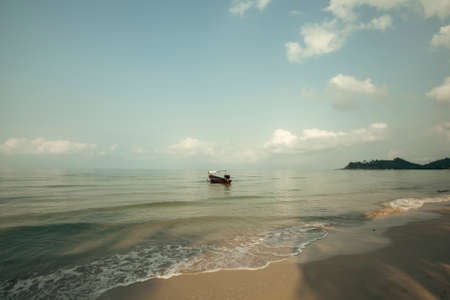 A tropical sea beach with a soft wave. Thailand.