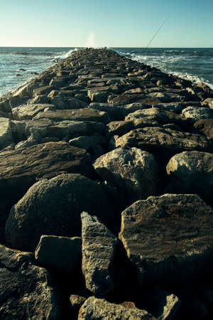 View of the pier of large stones on the Atlantic coast, Espinho, Portugal.の写真素材