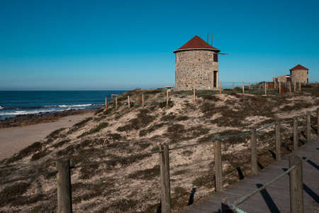 A wooden walkway across the dunes on the Atlantic coast, northern Portugal.の写真素材