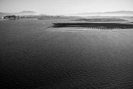 Lima river from the Ponte Eiffel bridge, Viana do Castelo, Portugal. Black and white photo.