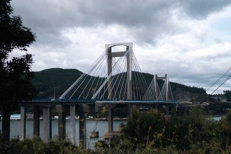 View of the Rande Bridge or Ponte de Rande, It spans Vigo bay across the Rande Strait, Galicia, Spain.の写真素材
