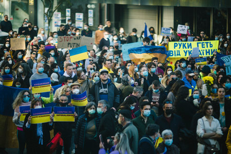 PORTO, PORTUGAL - FEB 27, 2022: During a demonstration against the Russian invasion of the Ukraine. Rally in support of the Ukraine was held in front of the Russian consulate.のeditorial素材