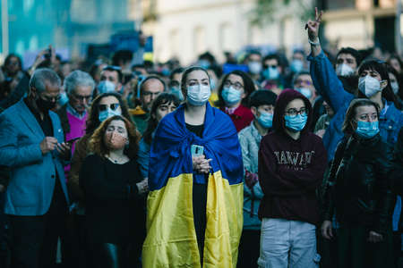 PORTO, PORTUGAL - FEB 27, 2022: During a demonstration against the Russian invasion of the Ukraine. Rally in support of the Ukraine was held in front of the Russian consulate.のeditorial素材