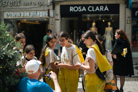 PORTO, PORTUGAL - MAY 8, 2023: Charity Day as part of Queima das Fitas - annual festivity of Portuguese students of universities. During this day students to collect donations for charitable causes.のeditorial素材