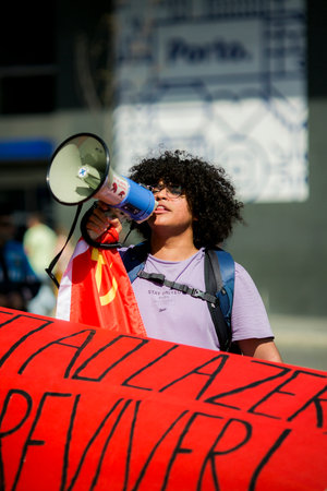 PORTO, PORTUGAL - MAY 1, 2023: During celebration of May Day in the Porto historical centre. In Portugal, it was after the Carnation Revolution 1974, that the May Day was again freely commemorated.のeditorial素材