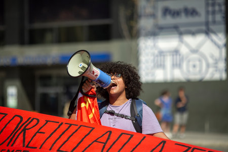 PORTO, PORTUGAL - MAY 1, 2023: During celebration of May Day in the Porto historical centre. In Portugal, it was after the Carnation Revolution 1974, that the May Day was again freely commemorated.のeditorial素材