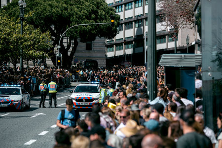 PORTO, PORTUGAL - MAY 9, 2023: Porto's Queima das Fitas Parade - annual festivity of Portuguese students of universities. The graduates wear a top-hat and a walking-cane, both colour of their Faculty.のeditorial素材