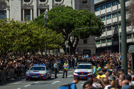 PORTO, PORTUGAL - MAY 9, 2023: Porto's Queima das Fitas Parade - annual festivity of Portuguese students of universities. The graduates wear a top-hat and a walking-cane, both colors of their Faculty.のeditorial素材