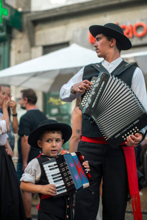 PORTO, PORTUGAL - YUL 1, 2023: Closing the week of Saint John festival, the popular marches aka Rusgas take to streets in the city. Festivities have been held in the Porto for more than six centuries.のeditorial素材