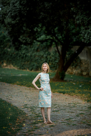 Women in the park in a seventies style dress.の写真素材