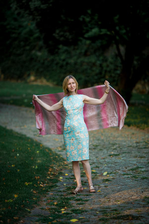 Women in the park in a dress with a scarf.の写真素材