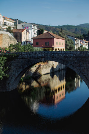 View of the pedestrian bridge in the mountain village of Vide (Seia) in the foot of Serra da Estrela, Portugal.の写真素材