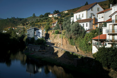 A river and village in the foothills of the Serra da Estrela, Portugal.の写真素材