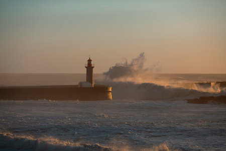 Porto lighthouse in Portugal with big waves.の写真素材