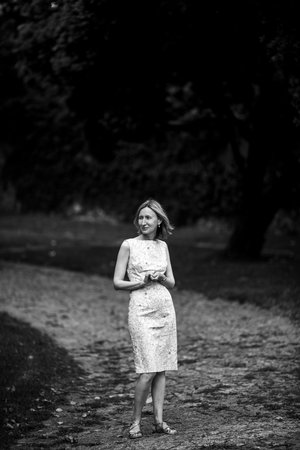 Woman on gravel path in park. Black and white photo.の写真素材