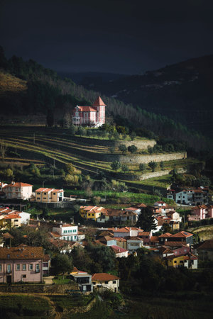 View of houses in a village in the hills of the Douro Valley in overcast weather.の写真素材