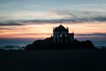 Chapel Senhor da Pedra in Miramar Beach at night, Porto, Portugal.の写真素材
