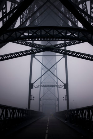 Lower level of the Dom Luis I Bridge in thick fog, Porto, Portugal.