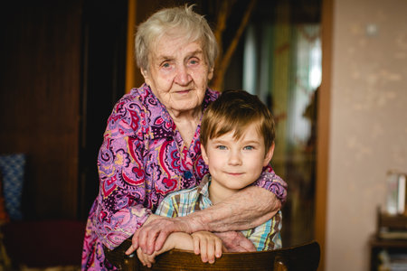 A grandma and her grandson enjoying each other's company in the comfort of their home.の写真素材