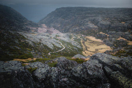 A panoramic view of the Serra da Estrela mountains in Portugal under stormy weather, showcasing...