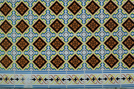 A fragment of Azulejo tiles on a traditional Portuguese home, offering a glimpse of age-old artistry and craftsmanship.の写真素材