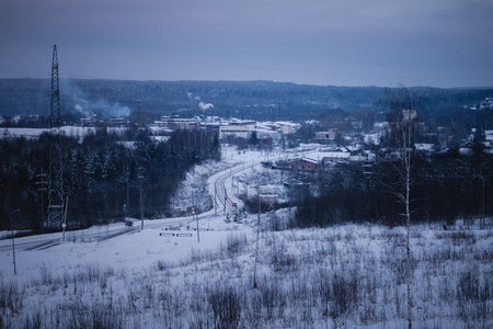 A winter view of an industrial settlement in northern Russia, surrounded by snow and frost.の写真素材