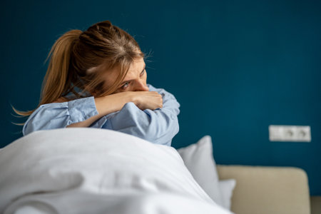Unhappy woman having depressive mood, feeling sadness and loss of interest in everythingの写真素材