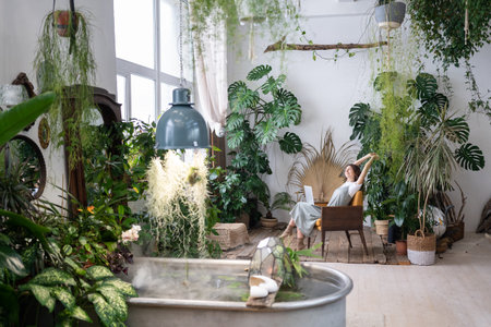 Young woman sitting in chair stretching arms, feeling satisfied. No stress reduce anxiety concept.の写真素材