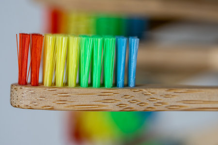 Eco friendly toothbrushes made of bamboo with recycled plastic bristles of different colorsの写真素材